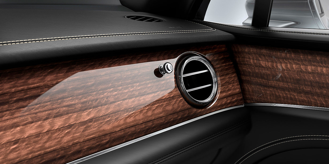 Bentley Suzhou Bentley Bentayga front interior Crown Cut Walnut veneer and chrome air vent.